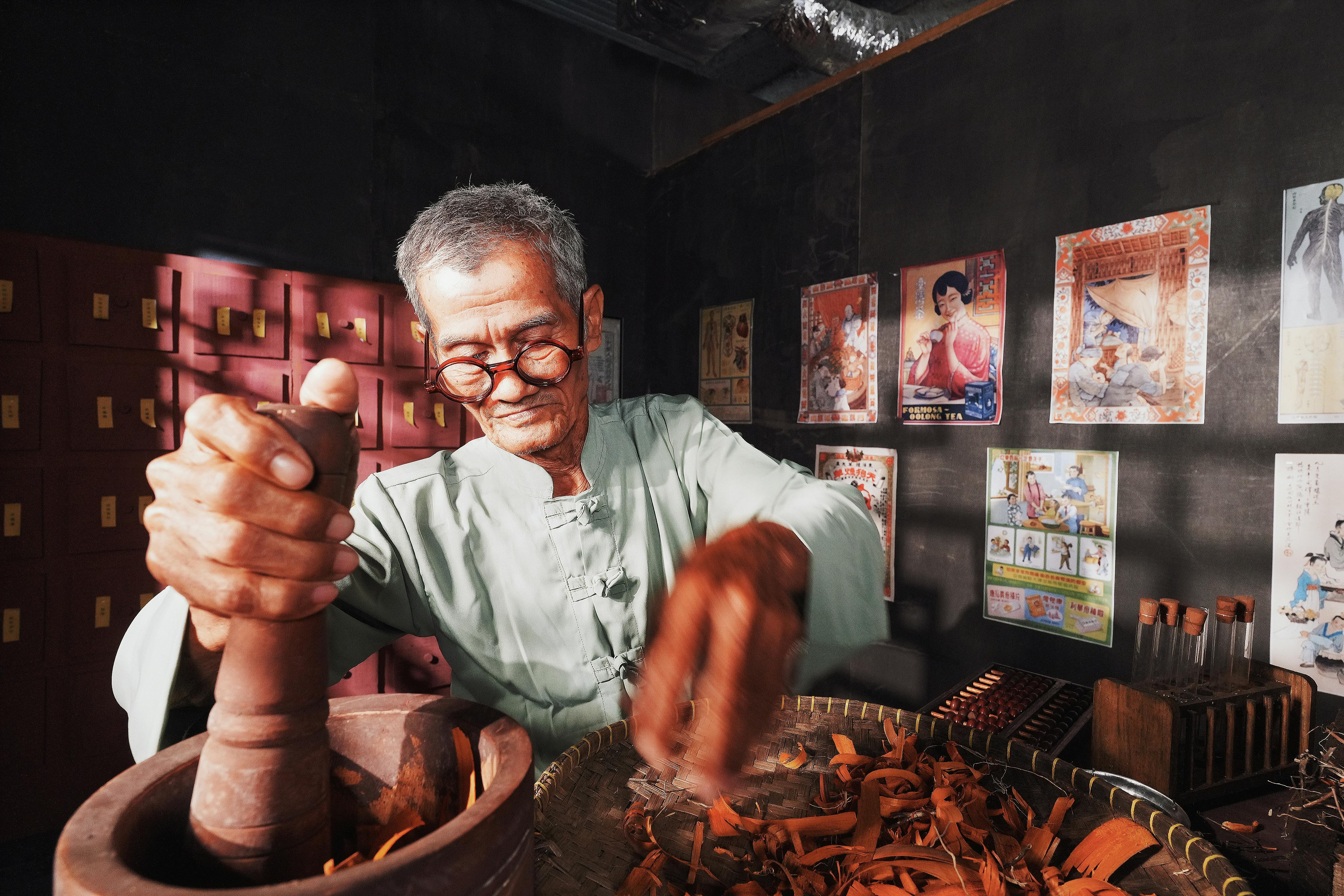 Herbalist preparing traditional ingredients